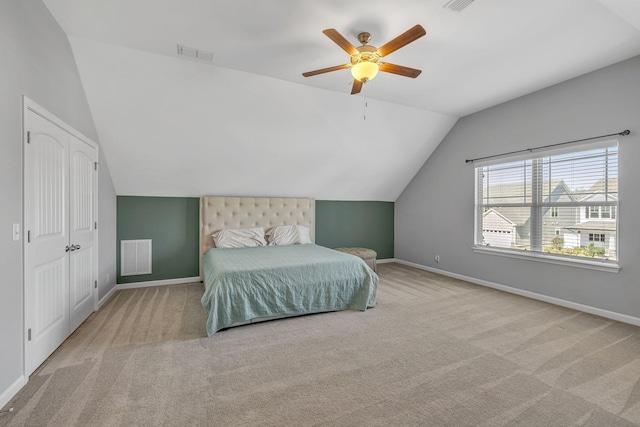 bedroom featuring carpet floors, visible vents, vaulted ceiling, and baseboards