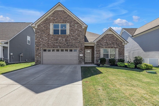 traditional-style house featuring a garage, a front yard, concrete driveway, and brick siding