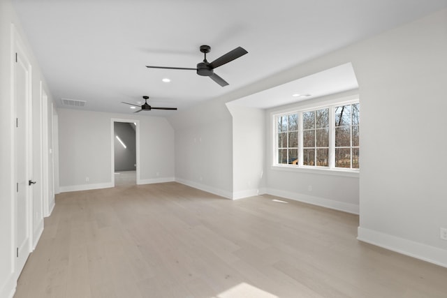 unfurnished room with visible vents, baseboards, and light wood-style floors