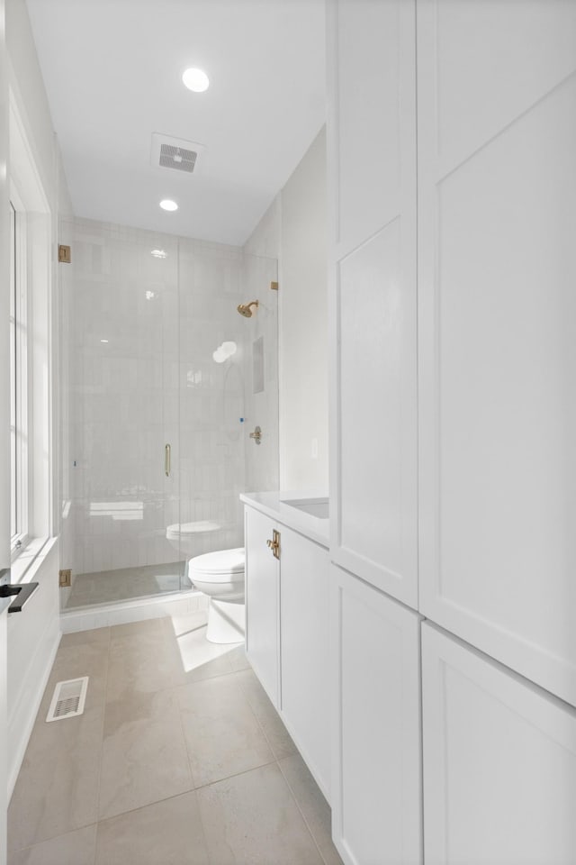 full bath featuring recessed lighting, visible vents, a shower stall, and toilet