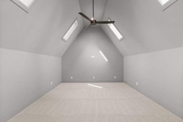 additional living space with carpet flooring, lofted ceiling, and a ceiling fan