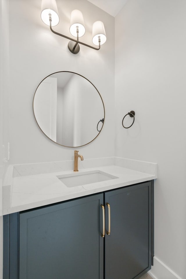 bathroom with vanity and baseboards