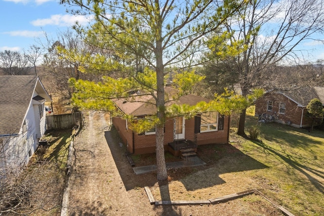 exterior space with fence and driveway