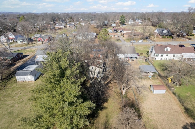 birds eye view of property with a residential view