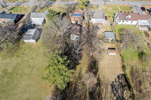 birds eye view of property with a residential view