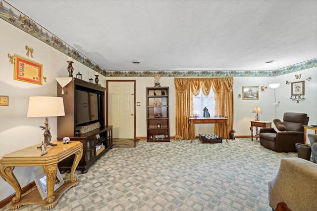 carpeted living area with baseboards and a textured ceiling