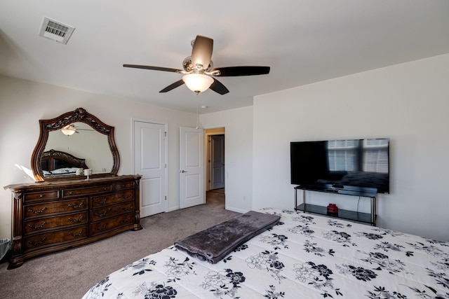 bedroom featuring carpet floors, visible vents, and a ceiling fan