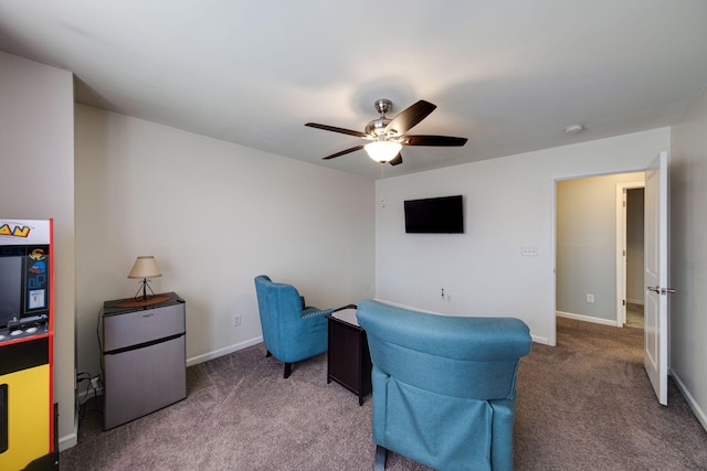 office area with carpet, ceiling fan, and baseboards