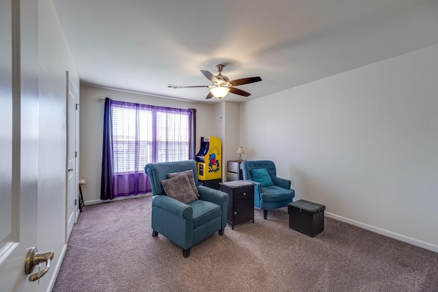 living area with carpet, visible vents, ceiling fan, and baseboards