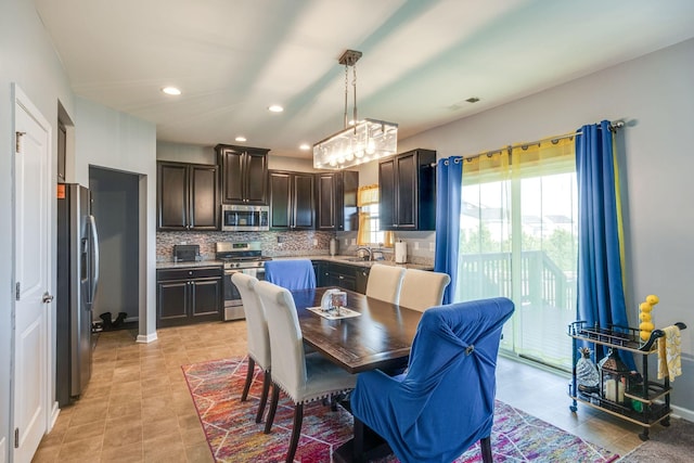 dining area with light tile patterned floors, baseboards, visible vents, and recessed lighting