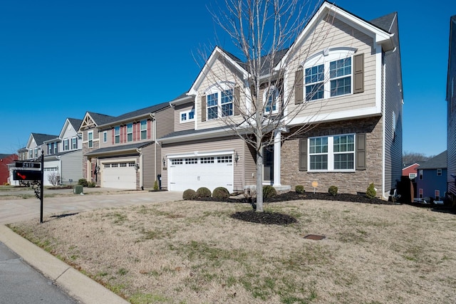 view of front facade featuring an attached garage, stone siding, a residential view, and concrete driveway