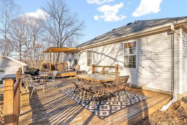 wooden deck with outdoor dining space