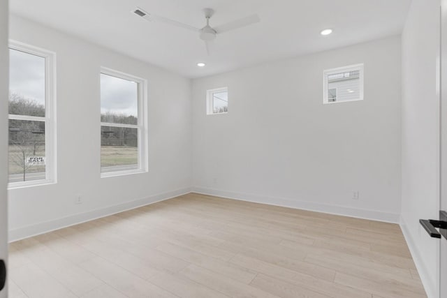 empty room with ceiling fan, recessed lighting, visible vents, baseboards, and light wood-style floors