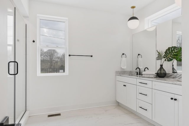 bathroom featuring visible vents, vanity, baseboards, marble finish floor, and a shower stall