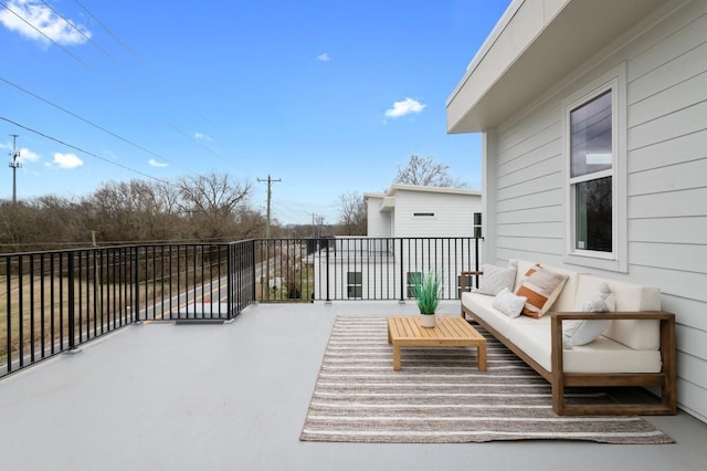 wooden terrace with outdoor lounge area