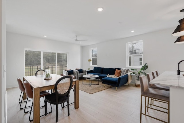 dining area with light wood-style floors, recessed lighting, and a ceiling fan