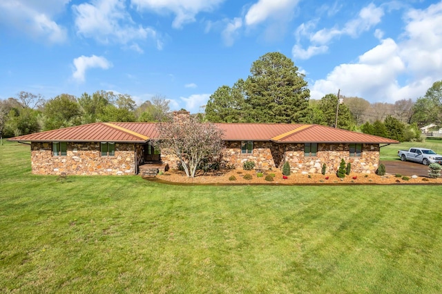 view of front of property with metal roof, stone siding, a front lawn, and a standing seam roof