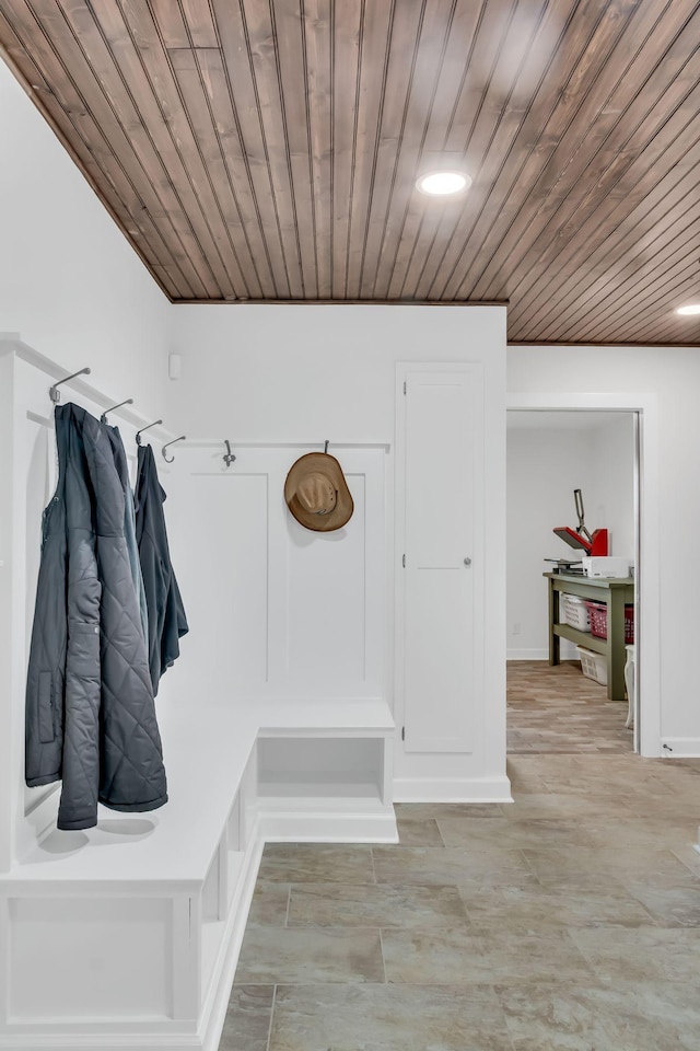 mudroom with recessed lighting, wooden ceiling, and baseboards