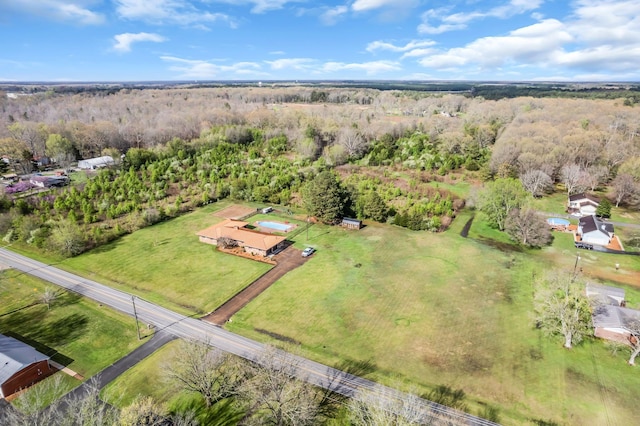 bird's eye view featuring a view of trees