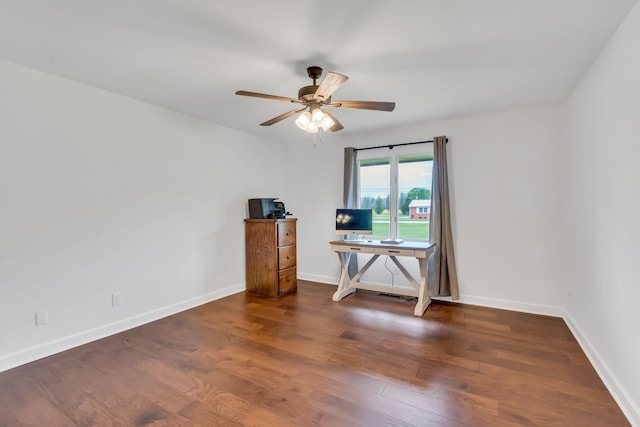 spare room featuring visible vents, wood finished floors, a ceiling fan, and baseboards