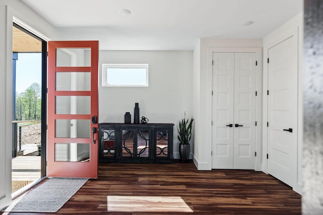 entrance foyer featuring wood finished floors and baseboards