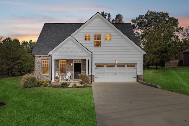 view of front of home featuring concrete driveway, brick siding, an attached garage, and a front lawn