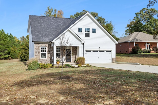 view of front of home featuring brick siding, roof with shingles, a front yard, a garage, and driveway