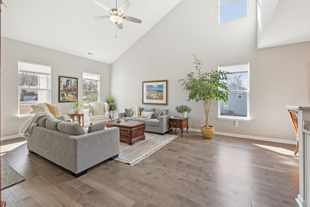 living room featuring ceiling fan, wood finished floors, and baseboards