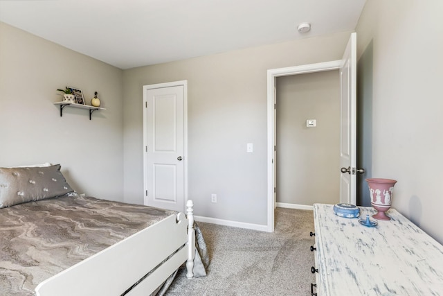 bedroom featuring carpet floors and baseboards