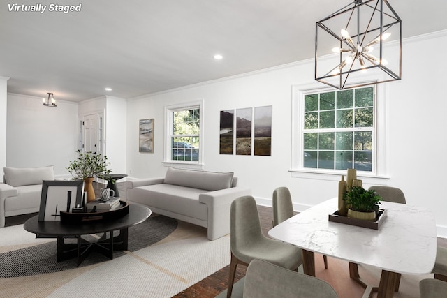 living area with recessed lighting, crown molding, baseboards, and wood finished floors