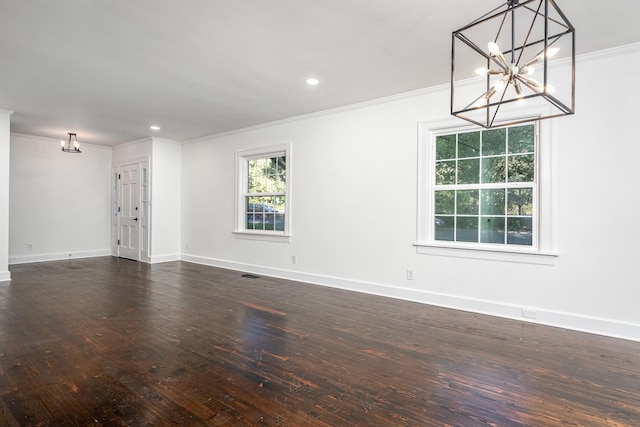 unfurnished room featuring dark wood-style floors, recessed lighting, visible vents, ornamental molding, and baseboards