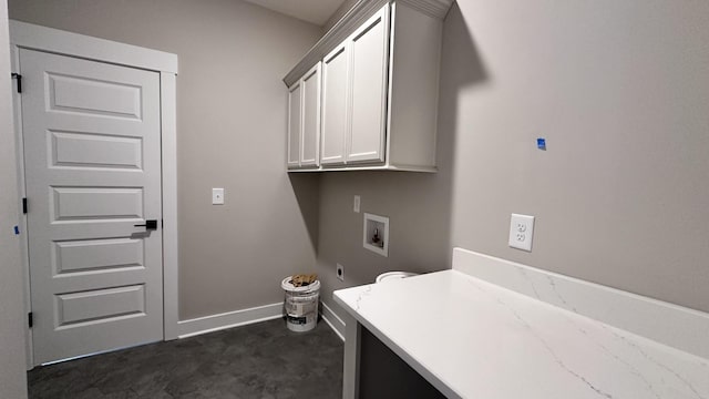 clothes washing area with baseboards, washer hookup, cabinet space, and hookup for an electric dryer