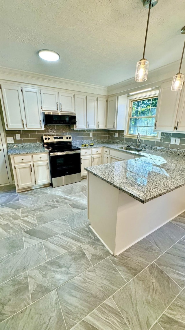 kitchen featuring stainless steel appliances, a sink, light stone counters, and decorative backsplash