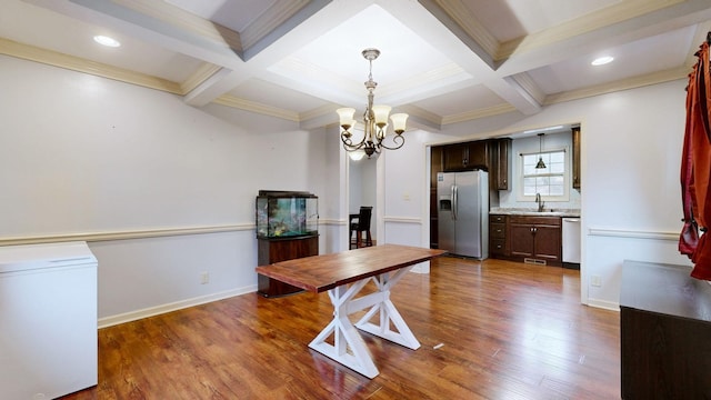 dining space featuring beamed ceiling, coffered ceiling, wood finished floors, and an inviting chandelier