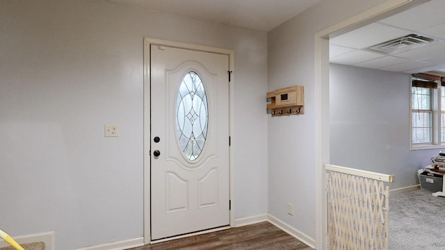 entryway with a drop ceiling, visible vents, and baseboards