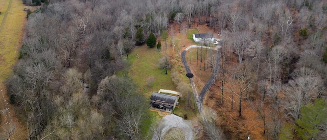 drone / aerial view featuring a forest view