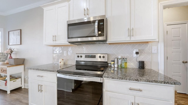 kitchen featuring appliances with stainless steel finishes, stone counters, and decorative backsplash