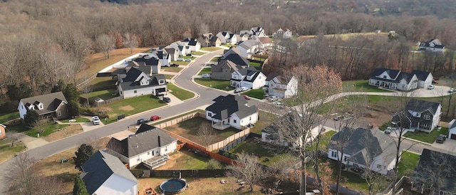 birds eye view of property with a residential view and a view of trees