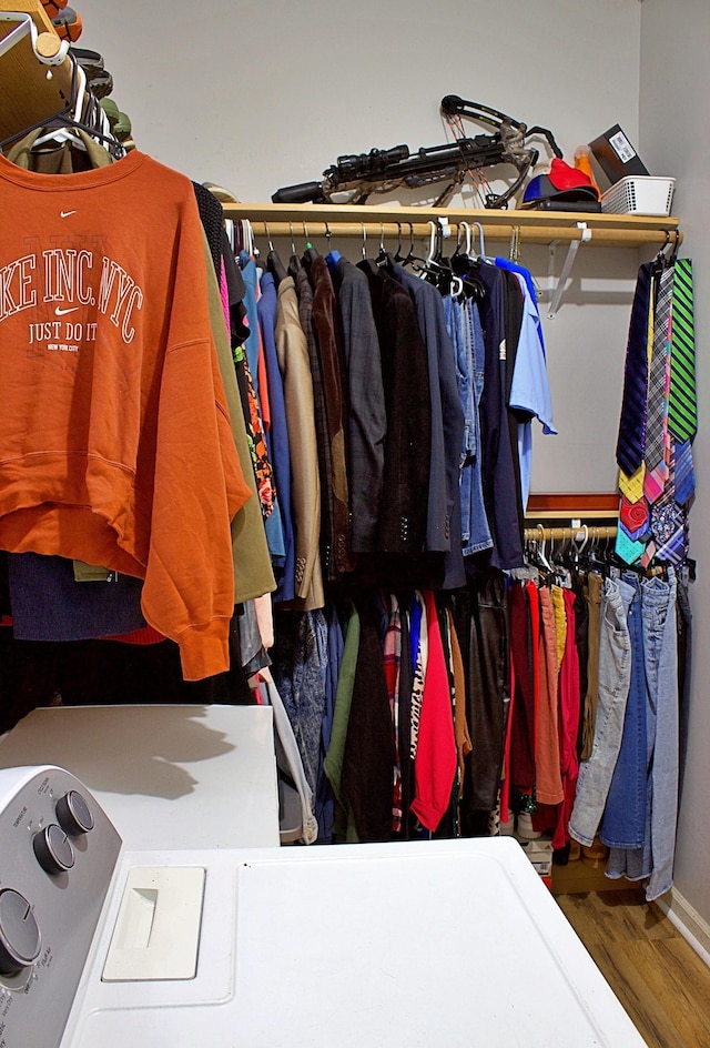 walk in closet featuring wood finished floors