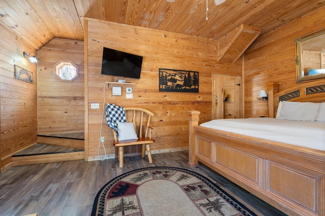 bedroom with vaulted ceiling, wood finished floors, wood ceiling, and wooden walls