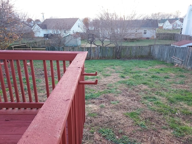 view of yard featuring a fenced backyard and a residential view