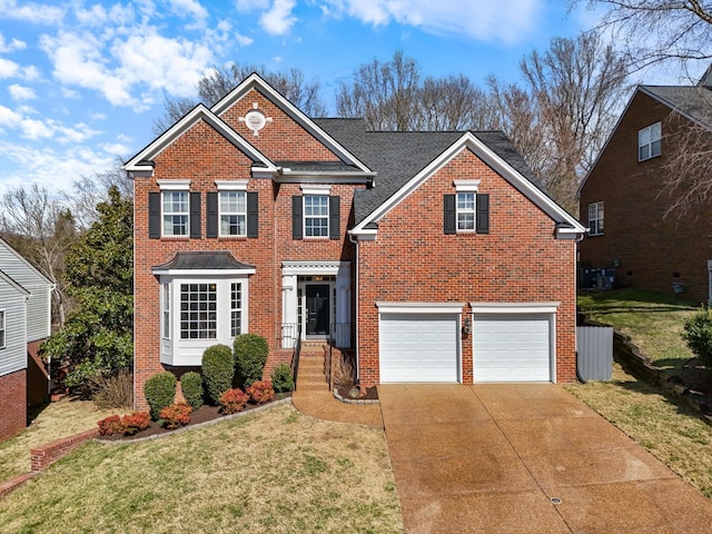 view of front of property featuring brick siding, a shingled roof, concrete driveway, an attached garage, and a front lawn