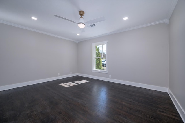 empty room featuring baseboards, visible vents, ornamental molding, and dark wood-style flooring