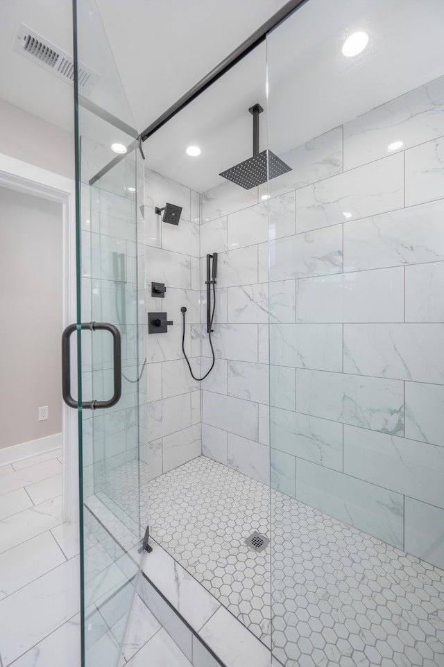 full bathroom with a stall shower, marble finish floor, visible vents, and recessed lighting