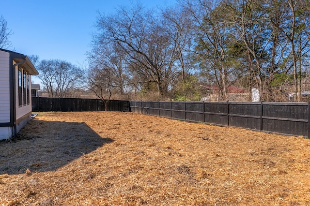 view of yard with a fenced backyard