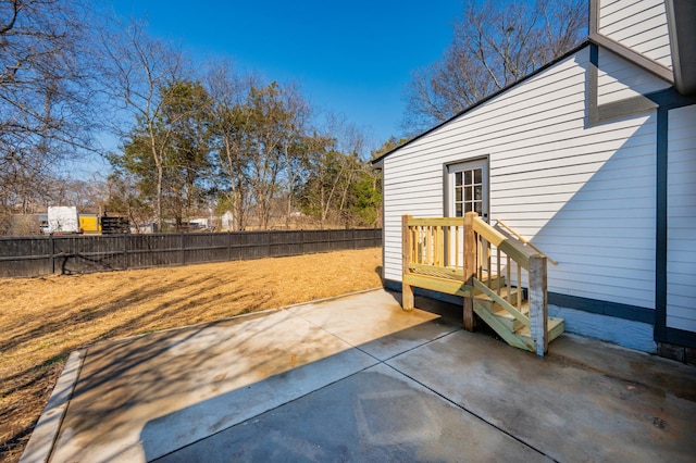 view of patio featuring fence