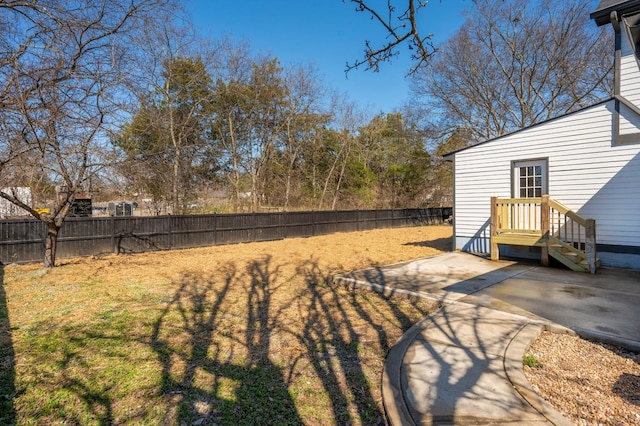 view of yard with a patio area and a fenced backyard