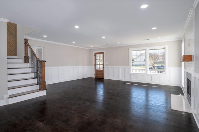 unfurnished living room with stairway, a premium fireplace, dark wood finished floors, and recessed lighting