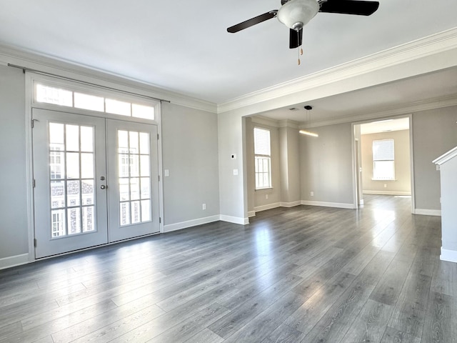 unfurnished room with baseboards, french doors, dark wood finished floors, and crown molding