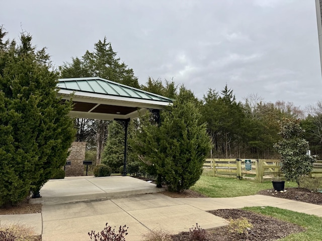 view of property's community featuring fence